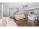 Living room with hardwood floors and view into the kitchen with a breakfast bar at 3711 Tip Ln, Mount Pleasant, SC 29466