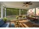 Spacious screened porch featuring stylish furniture and scenic outdoor views at 3711 Tip Ln, Mount Pleasant, SC 29466