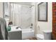 Bright bathroom features shower over tub and stylish fixtures at 3935 Walnut St, North Charleston, SC 29405