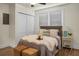 Cozy bedroom with comfortable bed, throw pillows, and woven bench at 3935 Walnut St, North Charleston, SC 29405