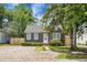 Charming single-story home boasts a landscaped front yard and gravel driveway at 3935 Walnut St, North Charleston, SC 29405