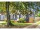 Quaint single-story home with a mature shade tree in the front yard at 3935 Walnut St, North Charleston, SC 29405