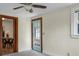 Room featuring a light blue door with glass panels and a dining area visible through a doorway at 3935 Walnut St, North Charleston, SC 29405