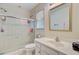 Bathroom features a shower and tub, vanity with sink, and window at 4 Garth Dr, Charleston, SC 29414
