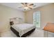Bedroom features a window, ceiling fan, and neutral carpet at 4 Garth Dr, Charleston, SC 29414