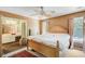 Spacious bedroom featuring ceiling fan, natural light, and attached bathroom at 4 Garth Dr, Charleston, SC 29414