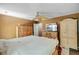 Bedroom features ceiling fan, large window, and dresser at 4 Garth Dr, Charleston, SC 29414