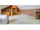Attic bonus room with built-in storage and entertainment unit, carpeted flooring at 4 Garth Dr, Charleston, SC 29414