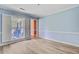 Empty dining room featuring light blue walls, white trim, and wood-look laminate flooring at 4 Garth Dr, Charleston, SC 29414