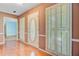 Elegant entryway featuring hardwood floors, decorative sidelight windows, and a classic front door at 4 Garth Dr, Charleston, SC 29414