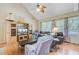 Vaulted living room with a ceiling fan, hardwood floors, and large windows providing natural light at 4 Garth Dr, Charleston, SC 29414