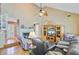 Cozy living room featuring hardwood floors, a fireplace, and a unique spiral staircase at 4 Garth Dr, Charleston, SC 29414