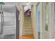 Carpeted staircase provides access to the upper level of the home at 4 Garth Dr, Charleston, SC 29414