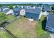 Aerial view of a large backyard with a grassy lawn and privacy fence at 414 Dovetail Cir, Summerville, SC 29483