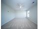 Spacious bedroom featuring neutral carpet, a ceiling fan, and a bright window at 414 Dovetail Cir, Summerville, SC 29483