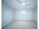Bright bedroom featuring a ceiling fan and large window at 414 Dovetail Cir, Summerville, SC 29483