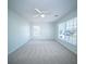 Large bedroom with two windows, carpet, and ceiling fan at 414 Dovetail Cir, Summerville, SC 29483