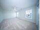 Spacious bedroom with carpet, ceiling fan, and multiple windows offers an airy and comfortable living space at 414 Dovetail Cir, Summerville, SC 29483