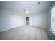 Spacious bedroom with neutral carpet, a ceiling fan, and a large closet at 414 Dovetail Cir, Summerville, SC 29483