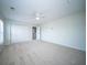Light-filled bedroom with carpet, ceiling fan, closet, and attached bath at 414 Dovetail Cir, Summerville, SC 29483