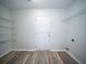 Bright closet featuring white wire shelving and wood-style flooring at 414 Dovetail Cir, Summerville, SC 29483