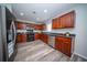 Modern kitchen with stainless steel appliances, dark countertops, and ample cabinet space at 414 Dovetail Cir, Summerville, SC 29483