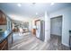 Open-concept kitchen leading to the dining area and living room, featuring stainless steel appliances at 414 Dovetail Cir, Summerville, SC 29483