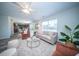 Bright living room featuring a ceiling fan, stylish furniture, and natural light from a window at 414 Dovetail Cir, Summerville, SC 29483