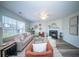 Bright and inviting living room boasts comfortable seating, fireplace, and contemporary decor, great for relaxation at 414 Dovetail Cir, Summerville, SC 29483