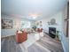 Cozy living room features stylish seating, fireplace, modern decor, and ample natural light at 414 Dovetail Cir, Summerville, SC 29483