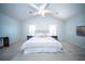 Bright main bedroom with vaulted ceiling, carpet, and large windows offers a peaceful retreat at 414 Dovetail Cir, Summerville, SC 29483