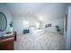 Bright main bedroom with vaulted ceiling, carpet, and large windows offers a peaceful retreat at 414 Dovetail Cir, Summerville, SC 29483
