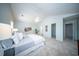Bright main bedroom with vaulted ceiling, carpet, and large windows offers a peaceful retreat at 414 Dovetail Cir, Summerville, SC 29483