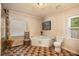 A bright bathroom features a corner soaking tub, tiled floors, and a window with natural light at 417 Dennis Ave, Moncks Corner, SC 29461