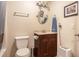 A cozy bathroom features a vanity, sink, mirror, and a toilet with a shower/tub at 417 Dennis Ave, Moncks Corner, SC 29461