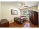 Cozy bedroom with hardwood floors, a ceiling fan, and natural light from the window at 417 Dennis Ave, Moncks Corner, SC 29461