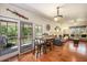 Cozy dining area featuring hardwood floors and direct access to the screened-in porch at 417 Dennis Ave, Moncks Corner, SC 29461