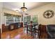 Cozy dining area featuring wood floors, natural light from window, and access to outdoor deck at 417 Dennis Ave, Moncks Corner, SC 29461