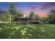 Spacious front yard with a charming single-Gathering home and inviting front porch at 417 Dennis Ave, Moncks Corner, SC 29461