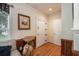 Hallway with hardwood floors, a decorative table, and neutral wall paint at 417 Dennis Ave, Moncks Corner, SC 29461