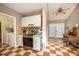Functional kitchen with checkerboard floors, stainless steel oven, and adjacent laundry room at 417 Dennis Ave, Moncks Corner, SC 29461
