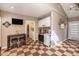 Bright kitchen with checkerboard flooring, laundry access, and a table with stools nearby at 417 Dennis Ave, Moncks Corner, SC 29461