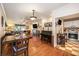 Inviting living room seamlessly connected to the kitchen with hardwood floors and natural light at 417 Dennis Ave, Moncks Corner, SC 29461