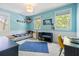 Bright blue bedroom with a custom-built striped bed frame and two windows provides a lively space at 5032 Coral Reef Dr, Johns Island, SC 29455