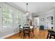 Cozy breakfast nook with hardwood floors, hanging pendant lighting, and bright windows at 5032 Coral Reef Dr, Johns Island, SC 29455