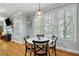 Breakfast nook with windows and hardwood floors, open to the living room with fireplace at 5032 Coral Reef Dr, Johns Island, SC 29455