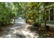 Long driveway leading to a detached garage and a well-maintained home at 5032 Coral Reef Dr, Johns Island, SC 29455