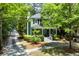 Charming two-story home with manicured landscaping, a detached garage and a tree-lined yard at 5032 Coral Reef Dr, Johns Island, SC 29455