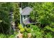Aerial view of a charming two-story home with a metal roof and tree-lined backyard at 5032 Coral Reef Dr, Johns Island, SC 29455