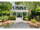 Charming two-story home with a inviting front porch and manicured landscaping at 5032 Coral Reef Dr, Johns Island, SC 29455